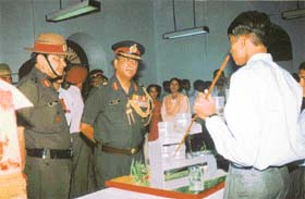 Lieut-General B. S. Thaksu, GOC 2 Corps, interacts with a student during a visit to Army Public School, Dagshai