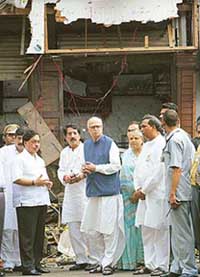 Deputy Prime Minister L. K. Advani inspects the site of a bomb blast at a market in Mumbai on Tuesday