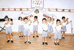 Students of Rainbow School, Sector 27, present an action song on the school campus in Chandigarh on Wednesday.