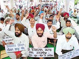 Members of the Senior Vocational Staff Association, Punjab, protest in support of their demands in Sector 17, Chandigarh, 
