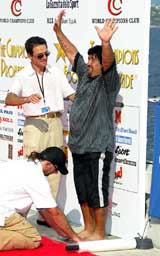 �Argentine soccer legend Diego Maradona waves as he imprints his feet into a cement plaque 