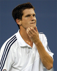 Tim Henman of Great Britain reacts after missing a point against Andy Roddick