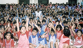 Indian hockey player Gagan Ajit Singh, surrounded by kids, at the Heritage School in Gurgaon.