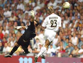 Real Madrid's David Beckham heads in his first goal for his new club in the Super Cup match against Mallorca 