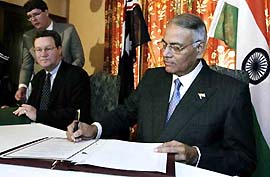 India's Minister for External Affairs Yashwant Sinha .is watched by his Australian counterpart Alexander Downer