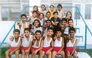 Young gymnasts are all smiles after participating in a competition