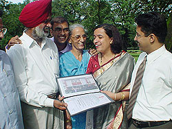 Ms Roop Abtar Kaur of Chandigarh shows her degree to her parents 