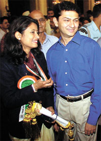 Anjali Ved Bhagat, who was today presented the Rajiv Gandhi Khel Ratna Award, with her husband after the function in the Capital on Friday. 