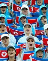 North Korean women cheer their women's soccer team during the final match against Japan 