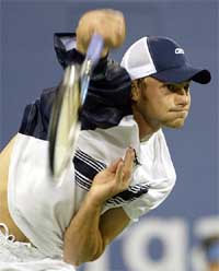 Andy Roddick of the US serves to Ivan Ljubicic of Croatia