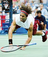 James Blake of the US dives for a shot from Sargis Sargsian of Armenia 