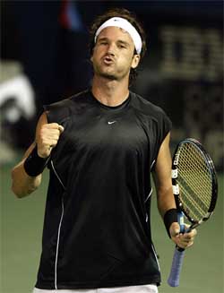 Carlos Moya of Spain celebrates his victory over Wesley Moodie of South Africa