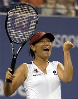 Tamarine Tanasugarn of Thailand celebrates her victory over Daniela Hantuchova of Slovakia