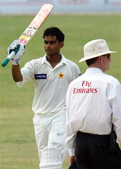 Pakistani batsman Mohammad Hafeez waves his bat after scoring his maiden Test century