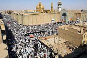 Shiite Muslims demonstrate outside the Imam Ali Shrine in Najaf