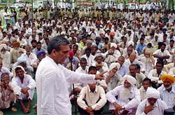 Former minister Nirmal Singh addresses a public meeting in Ambala