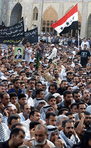 Iraqis attend the funeral of Muslim Shia leader Ayatollah Mohammad Baqer al-Hakim in Baghdad