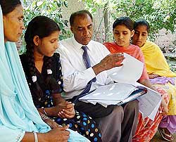 Mr Sital Kaler, case coordinator of the South Asian Human Rights Group of Canada, shows the documents of the Supreme Court of Pakistan