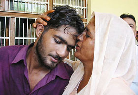Mrs Kailasho Devi hugs her son Ranjit Kumar