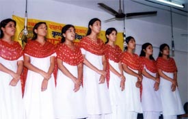 Students participate in an inter-school national group song competition