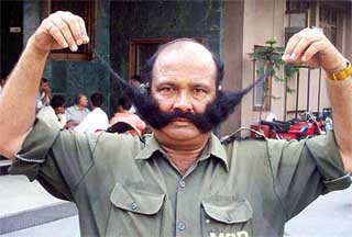 Kewal Krishan, a security guard with the MBD group, who has become popular for his 15.7-inch moustache