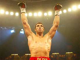 Ukraine's Vladimir Klitschko raises his arms after knocking out Fabio Moli 