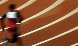 John Capel of the US runs the first leg of the men's 4x100m relay race 