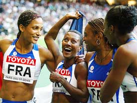 France's gold medal winners in the women's 4 x 100 relay finals celebrate in Paris 