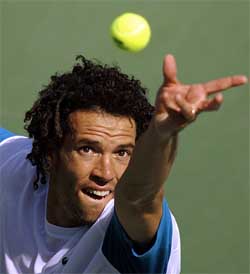 Younes El Aynaoui of Morocco serves to Jiri Novak of the Czech Republic