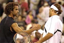 James Blake of the US congratulates Roger Federer of Switzerland 