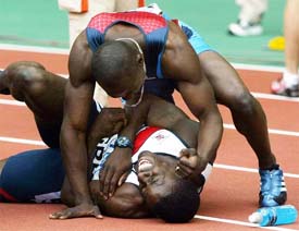 Joshua Johnson of the US pretends to throw a punch at Dwain Chambers of Britain 