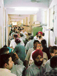 Traders crowd outside the office of the Assistant Excise and Taxation Commissioner