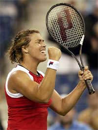 Jennifer Capriati of the USA celebrates her win over Elena Dementieva of Russia during their match