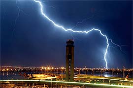 Lightning strikes just south of the McCarran International Airport's air traffic control tower 