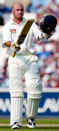 Herschelle Gibbs acknowledges the crowd's applause after reaching his century