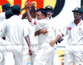 Bangladesh captain Khaled Mahmud celebrates the dismissal of Pakistani opener Salman Butt