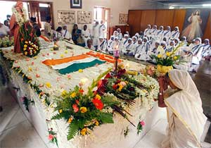 Catholic nuns from the Missionaries of Charity and Indian Christians gather at the tomb of Mother Teresa
