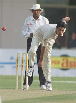 Pakistan's Umar Gul bowls against Bangladesh