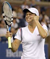 Kim Clijsters of Belgium celebrates her win over Amelie Mauresmo of France