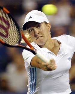 Justine Henin-Hardenne of Belgium serves to Anastasia Myskina 