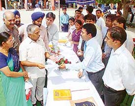 Members of Sanjivani, an NGO, listen to a query from senior citizens