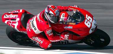 Italian rider Loris Capirossi on a Ducati takes a curve during the second qualifying practice session for the Portuguese Grand Prix