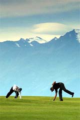 Paul Eales from Great Britain and Henrik Bjornstad from Norway pick up their golf balls next to the 7th hole 