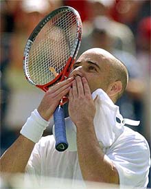 Andre Agassi of the USA celebrates his 6-3, 6-4, 7-5 win against Guillermo Coria of Argentina at the US Open