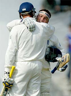 Graham Thorpe hugs teammate Marcus Trescothick after scoring a century 