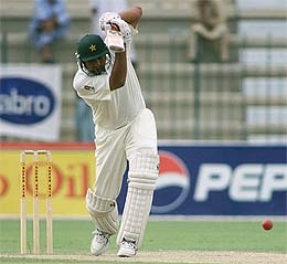 Pakistani batsman Inzamam-ul-Haq hits a straight drive against Bangladesh 