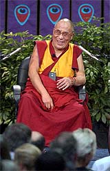The Dalai Lama laughs during his speech at San Francisco University 