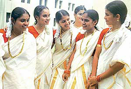 Young girls get ready for a dance presentation during Onam celebrations organised by the Kerala Samajam at Pastoral Centre of Christ the King Cathedral at Sector 19-B in Chandigarh on Sunday.