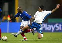 France's Claude Makelele fights for the ball with Michael Konstantinou of Cyprus 