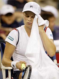 A dejected Kim Clijsters sits in her chair after losing the women's singles final of the US Open